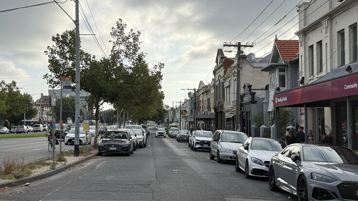 Queens Parade in Clifton Hill looking north, showing parked abundant parking spaces.